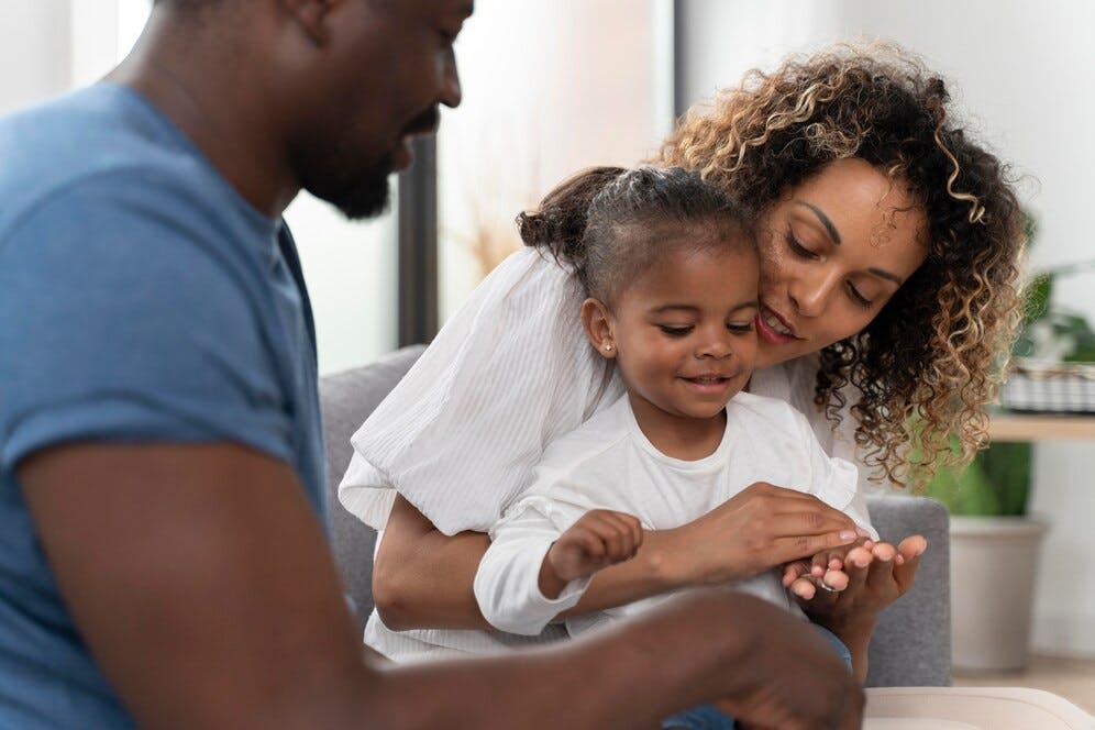 parents-spending-time-with-their-little-daughter