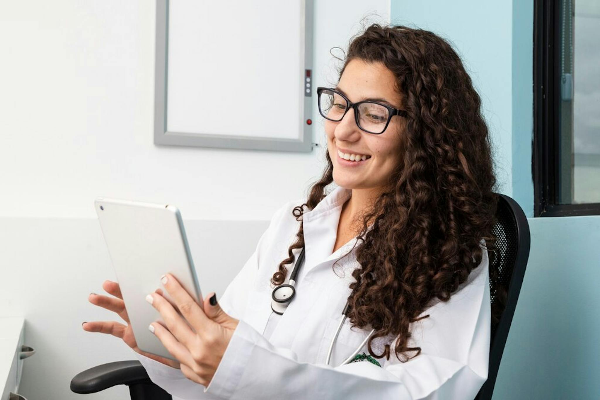 doctor-checking-her-tablet