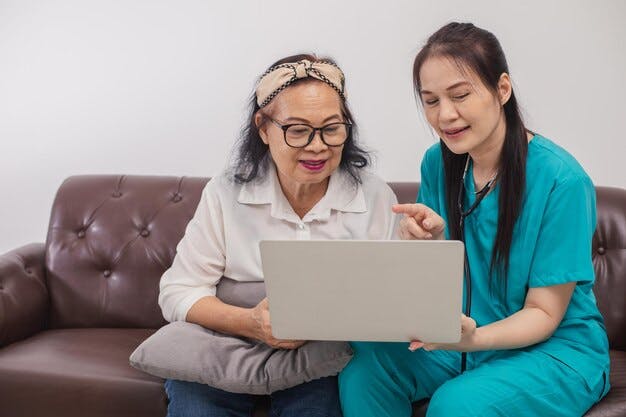 asian-female-doctor-explaining-medical-information-to-senior-patient