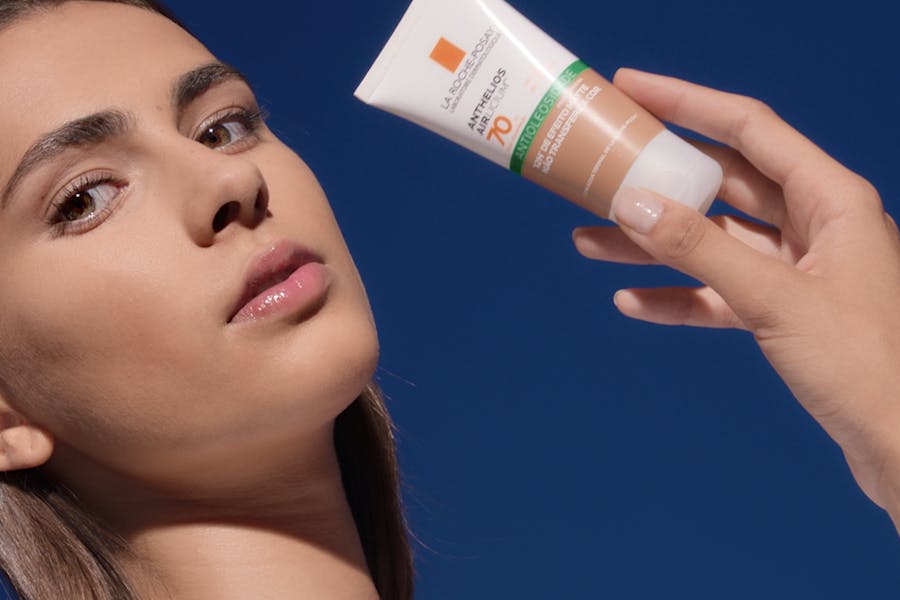 Model posing with La Roche-Posay Anthelios