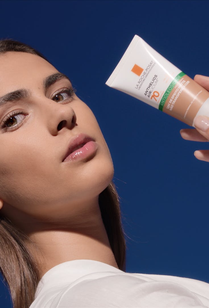 Model posing with La Roche-Posay Anthelios