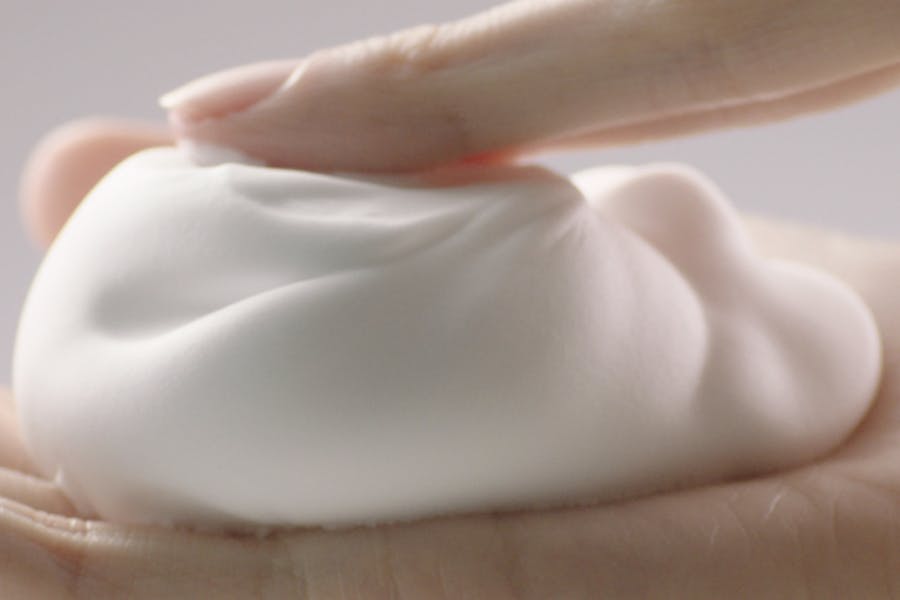 Hand with Garnier Whip Foam