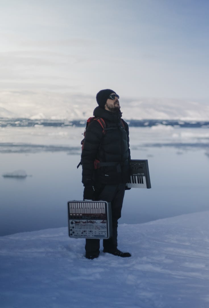 Picture of a man with music instruments in Greenland