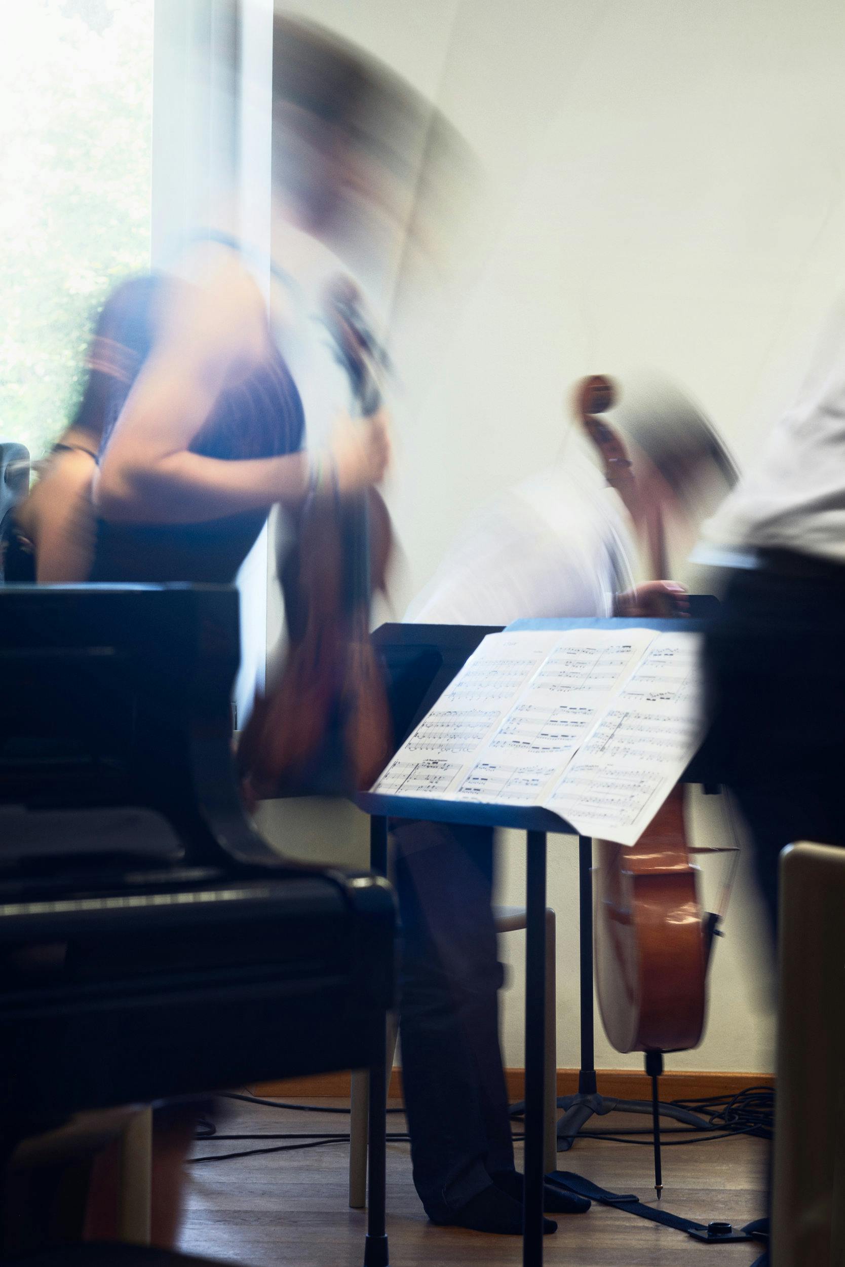 Blurry Image of woman playing violin