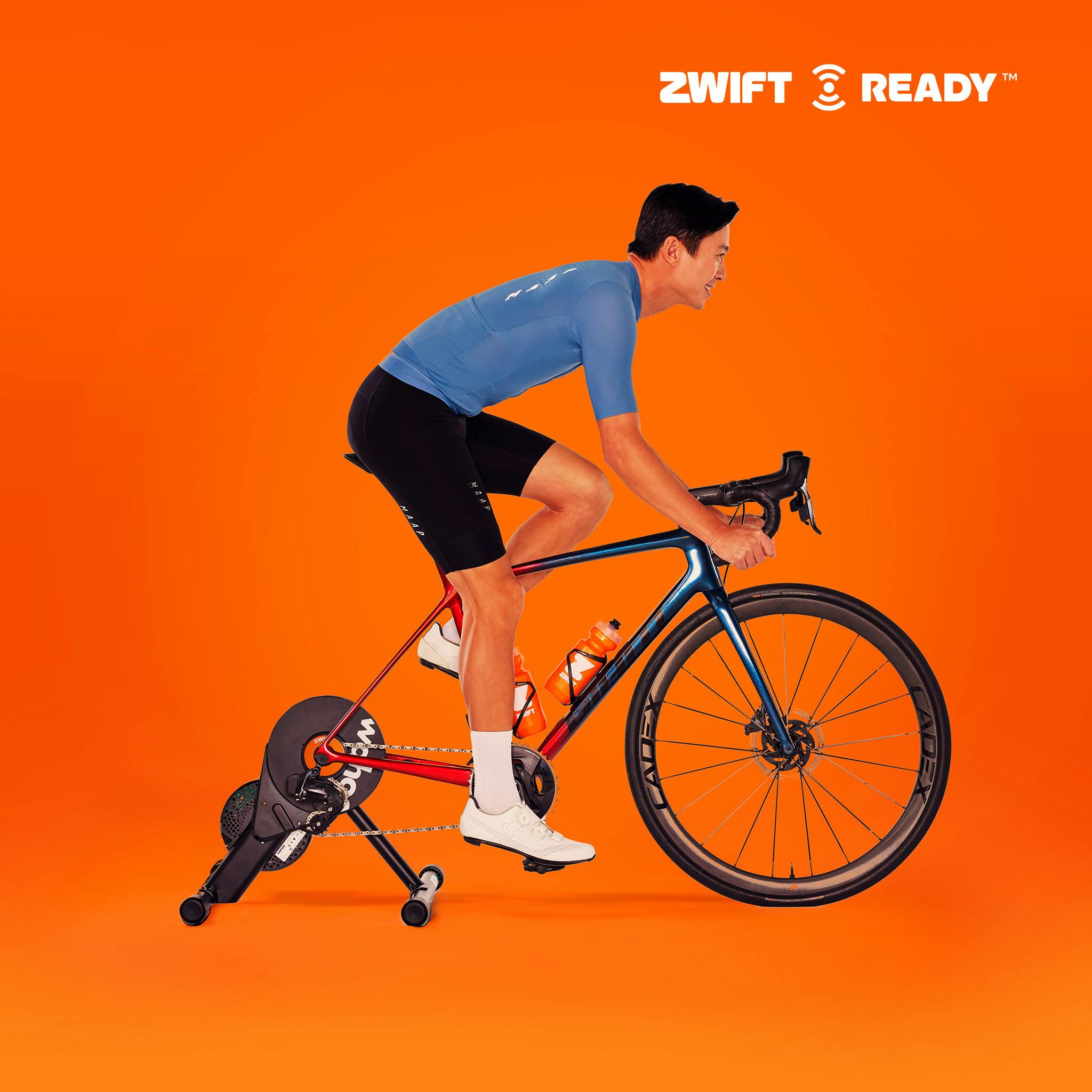 Man riding on his own bike mounted on a Zwift Ready smart trainer